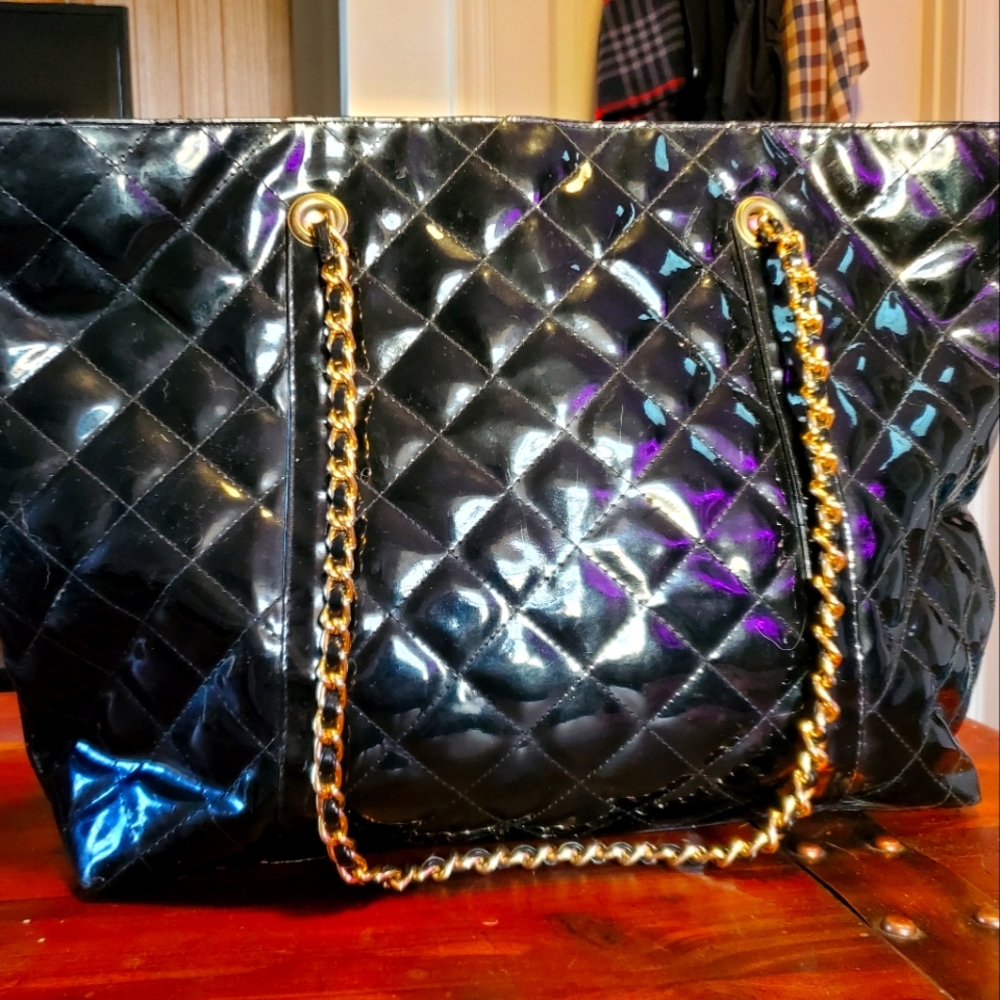Quilted black and gold handbag